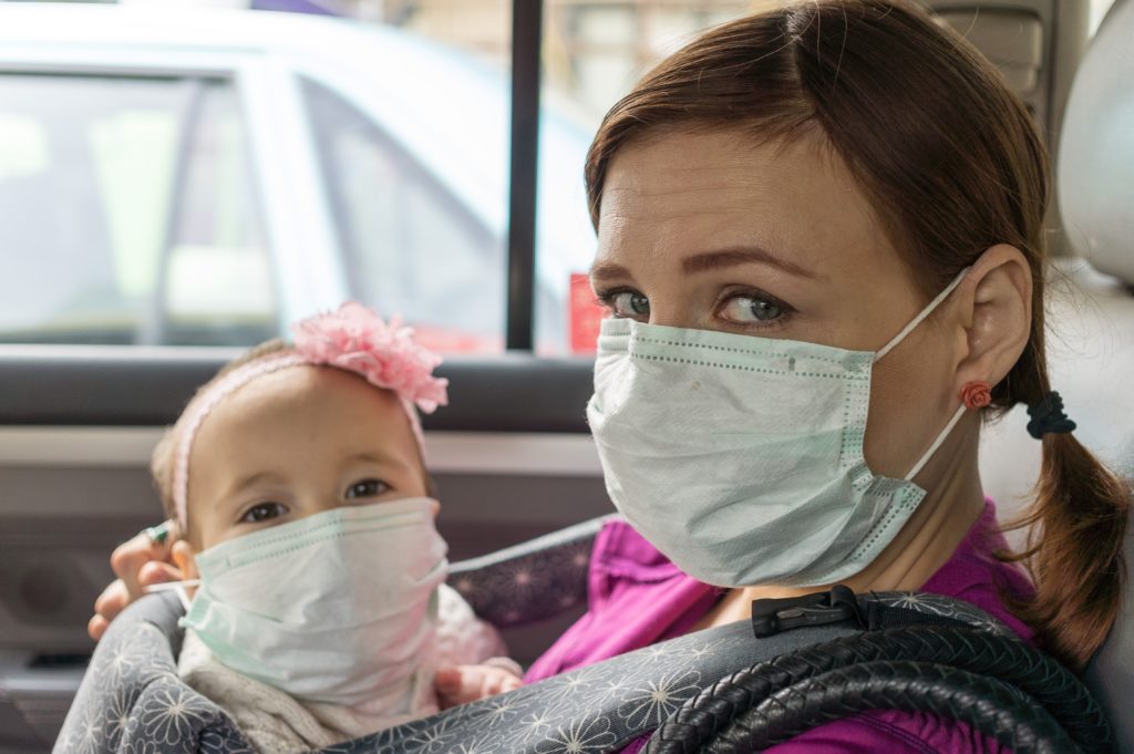 mom and baby wearing face masks