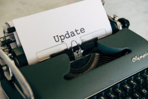 "Update" typed on paper in typewriter