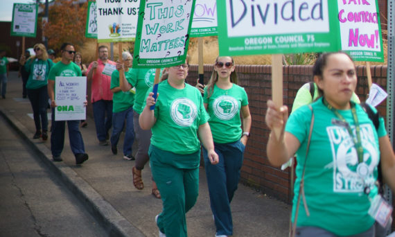 AFSCME and ONA Members with Picket Signs