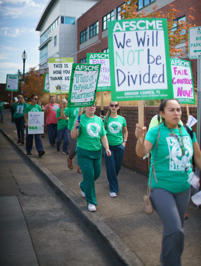 AFSCME and ONA Members with Picket Signs